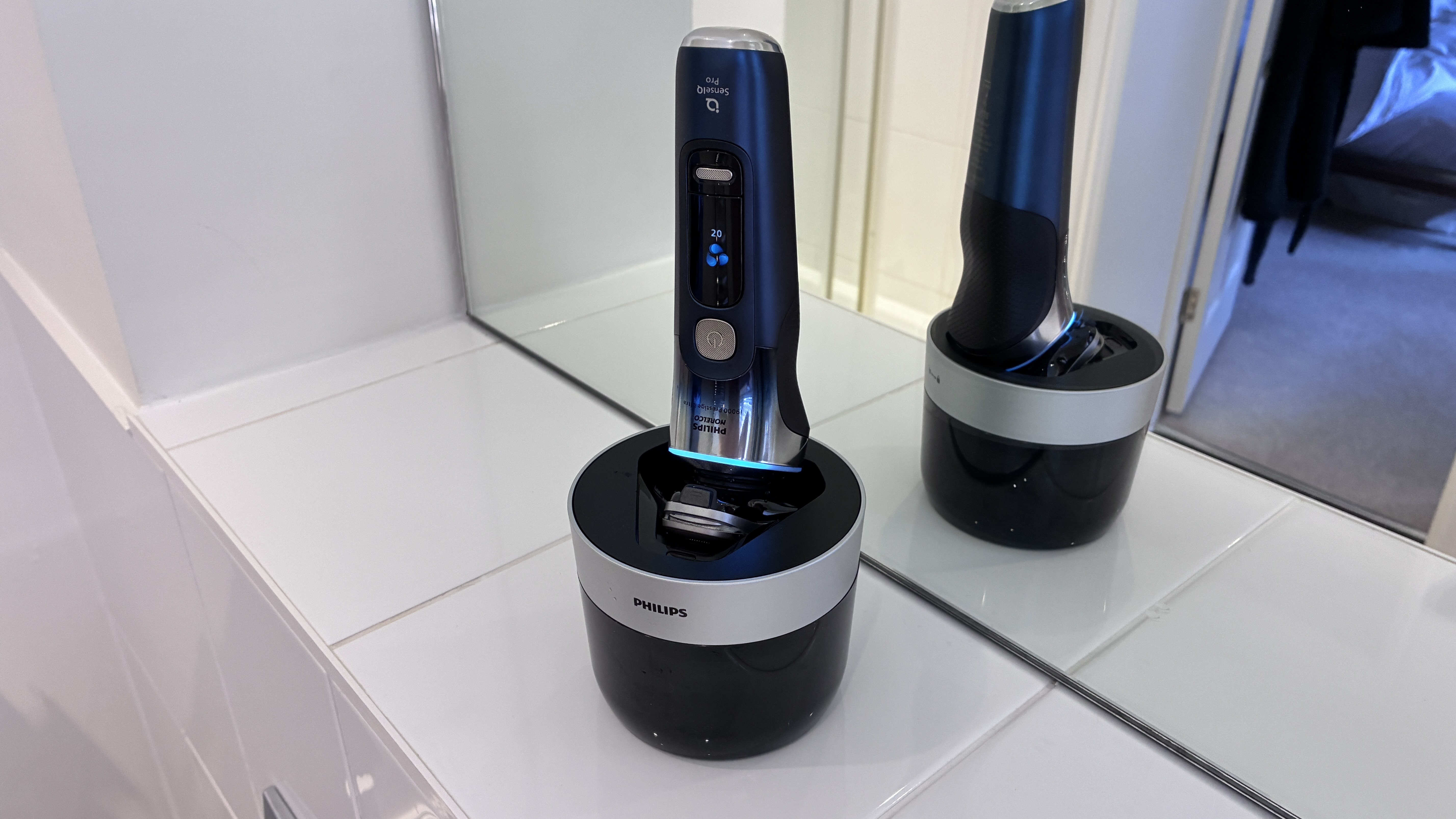Philips Norelco i9000 Prestige Ultra Day &amp;amp; Night shaver in cleaning unit