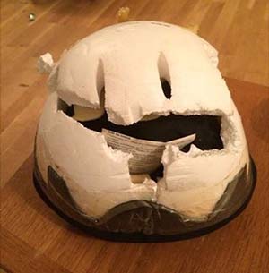 Lucy's riding hat has taken the impact of her fall, saving her from more serious injury