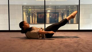 Personal trainer Aimee Victoria Long performing the Pilates 100
