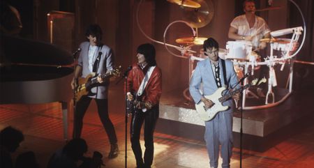 The Pretenders live in 1984: (left to right) Malcolm Foster, Chrissie Hynde, Robbie McIntosh and Martin Chambers