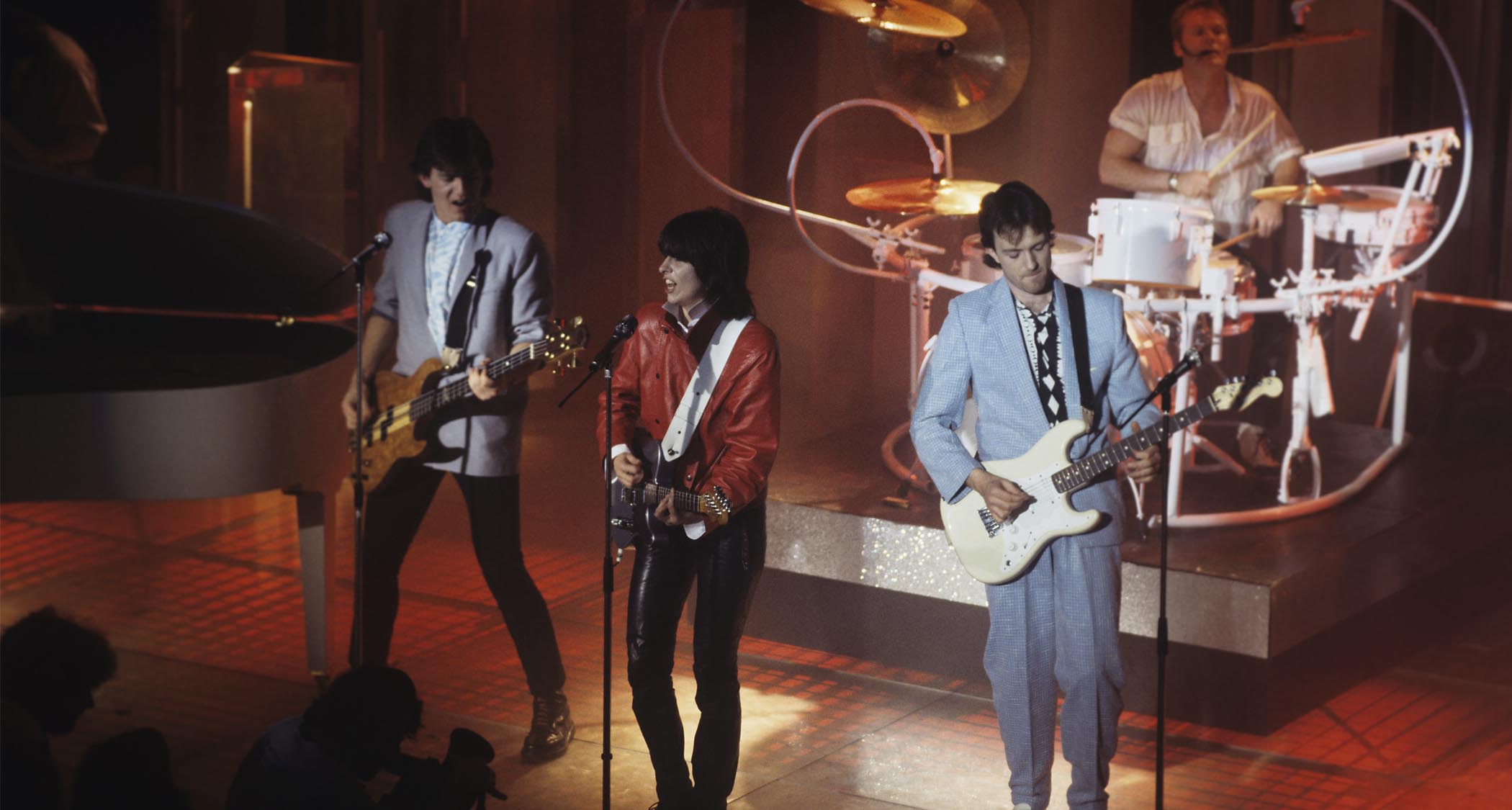 The Pretenders live in 1984: (left to right) Malcolm Foster, Chrissie Hynde, Robbie McIntosh, and Martin Chambers