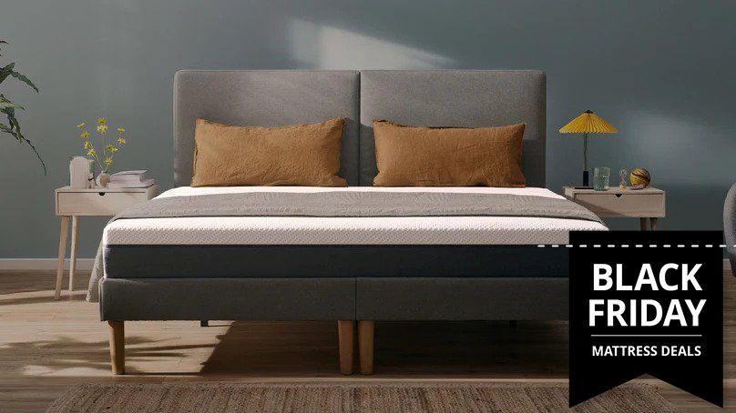 The Emma Original Mattress placed on a grey bed frame with a Black Friday mattress deals image overlaid on top 