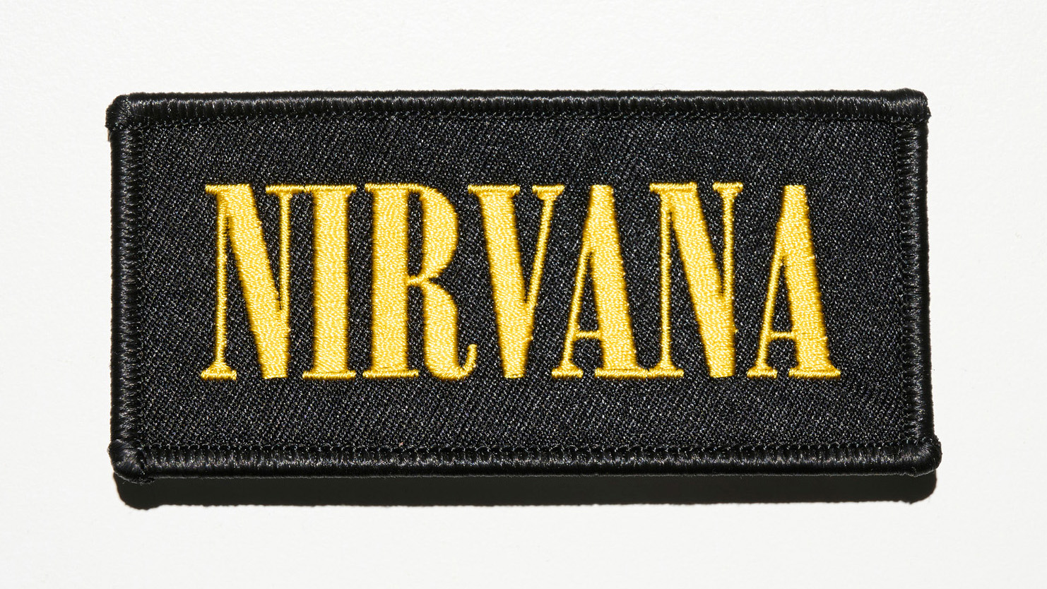 Nirvana logo in yellow on a black patch