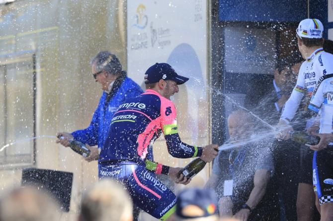 The champagne flows on the podium after stage 1