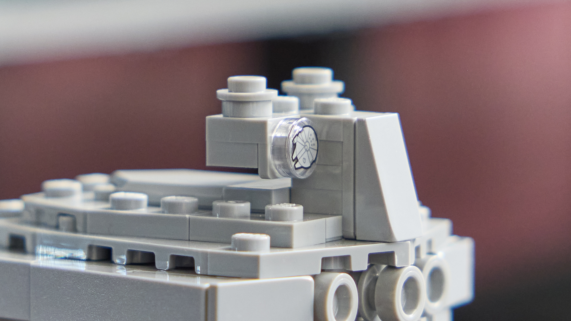 Lego Millennium Falcon stud on the miniature Star Destroyer model