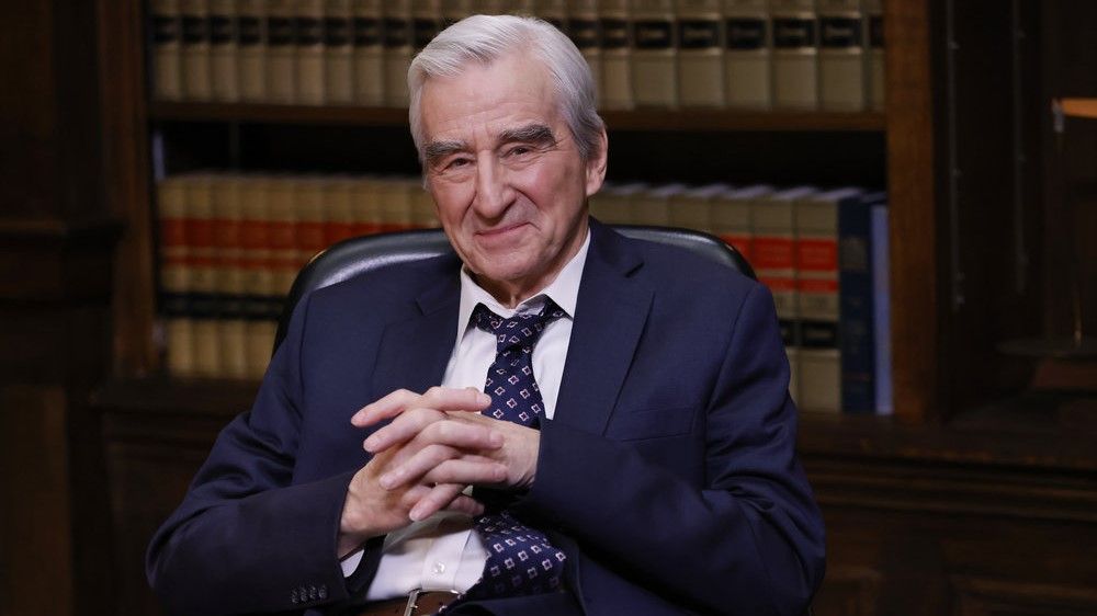 Sam Waterston as DA Jack McCoy smiling in Law &amp; Order season 23