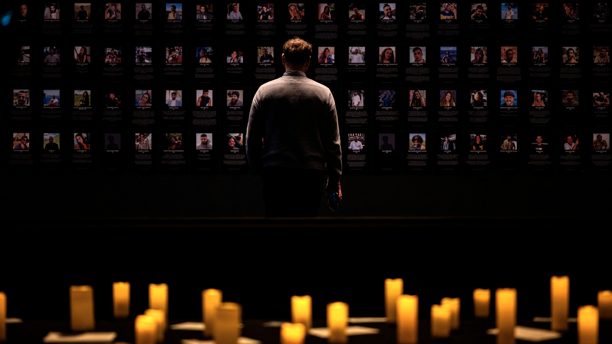 A man looks at photographs