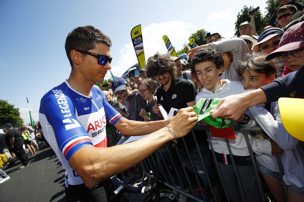 Warren Barguil interacts with fans before the start of stage 10 at the tour de France