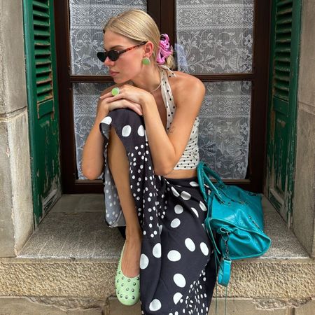 A collage of the chicest polka dot trends for summer 2026.
