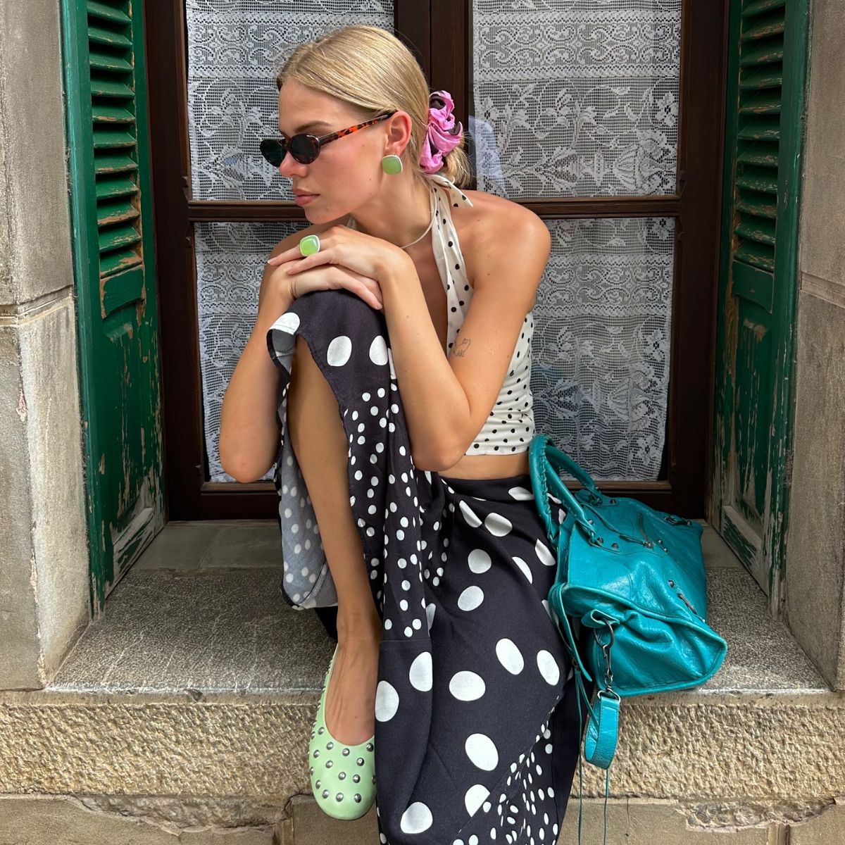 A collage of the chicest polka dot trends for summer 2026.
