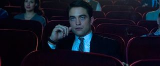 Life Robert Pattinson sitting in a theater, watching a movie