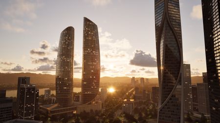 Skyscrapers glitter in the light of a setting sun.