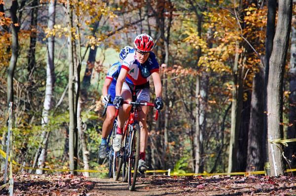 Lyne Bessette (Cyclocrossworld.com) leading Katerina Nash (Luna Pro Team) through the forest in New Gloucester