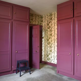 Burgundy fitted wardrobes in bedroom