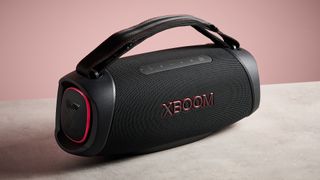 LG XBoom Go XG8T against a pink background