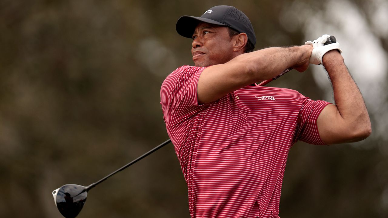 Tiger Woods holds his finish on a drive