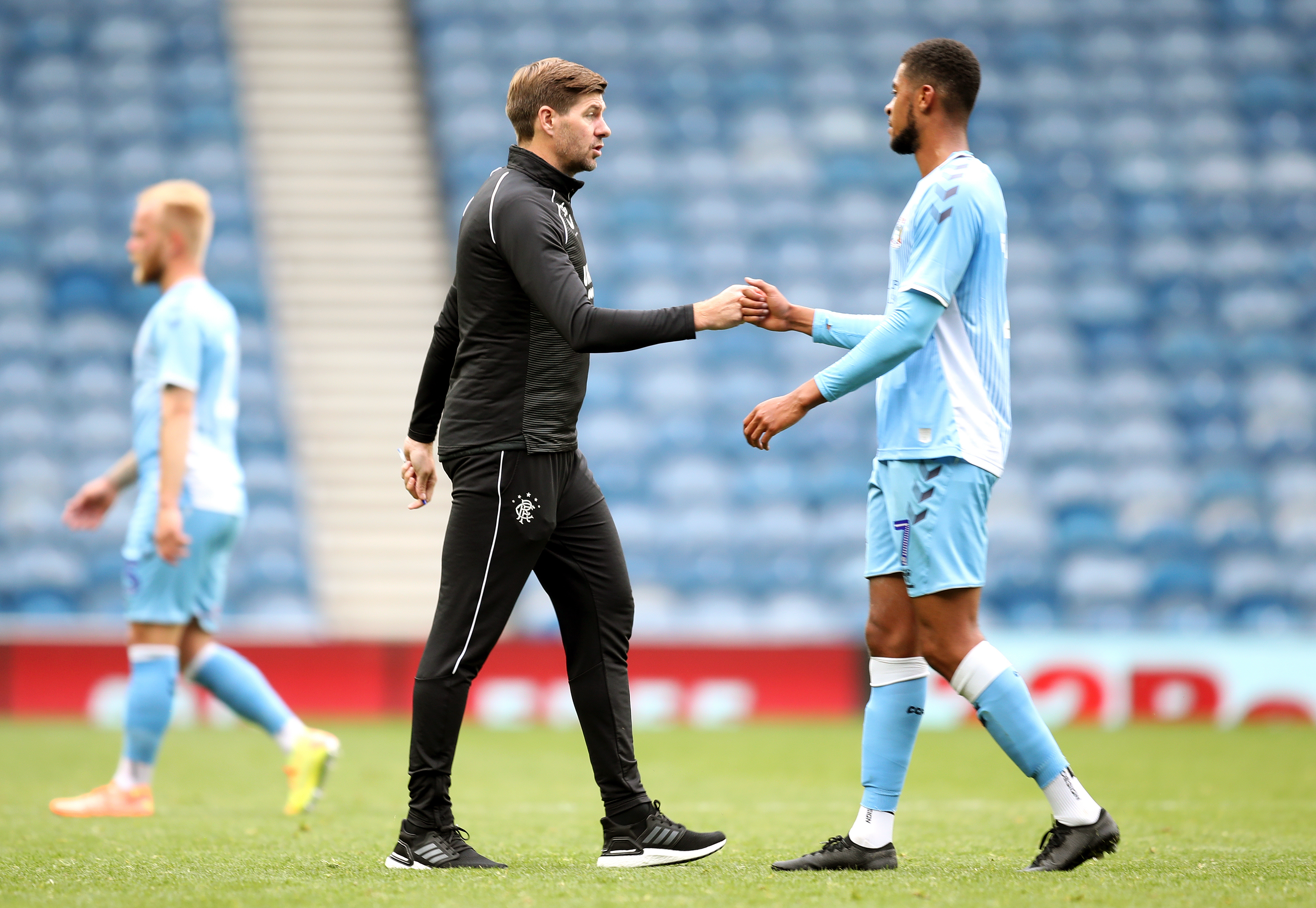 Rangers manager Steven Gerrard fist-bumps Coventry’s Jordon Thompson