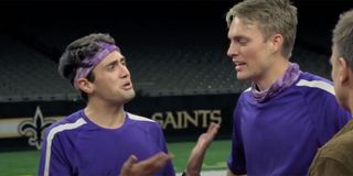 Will and James dressed in matching purple shirts on The Amazing Race
