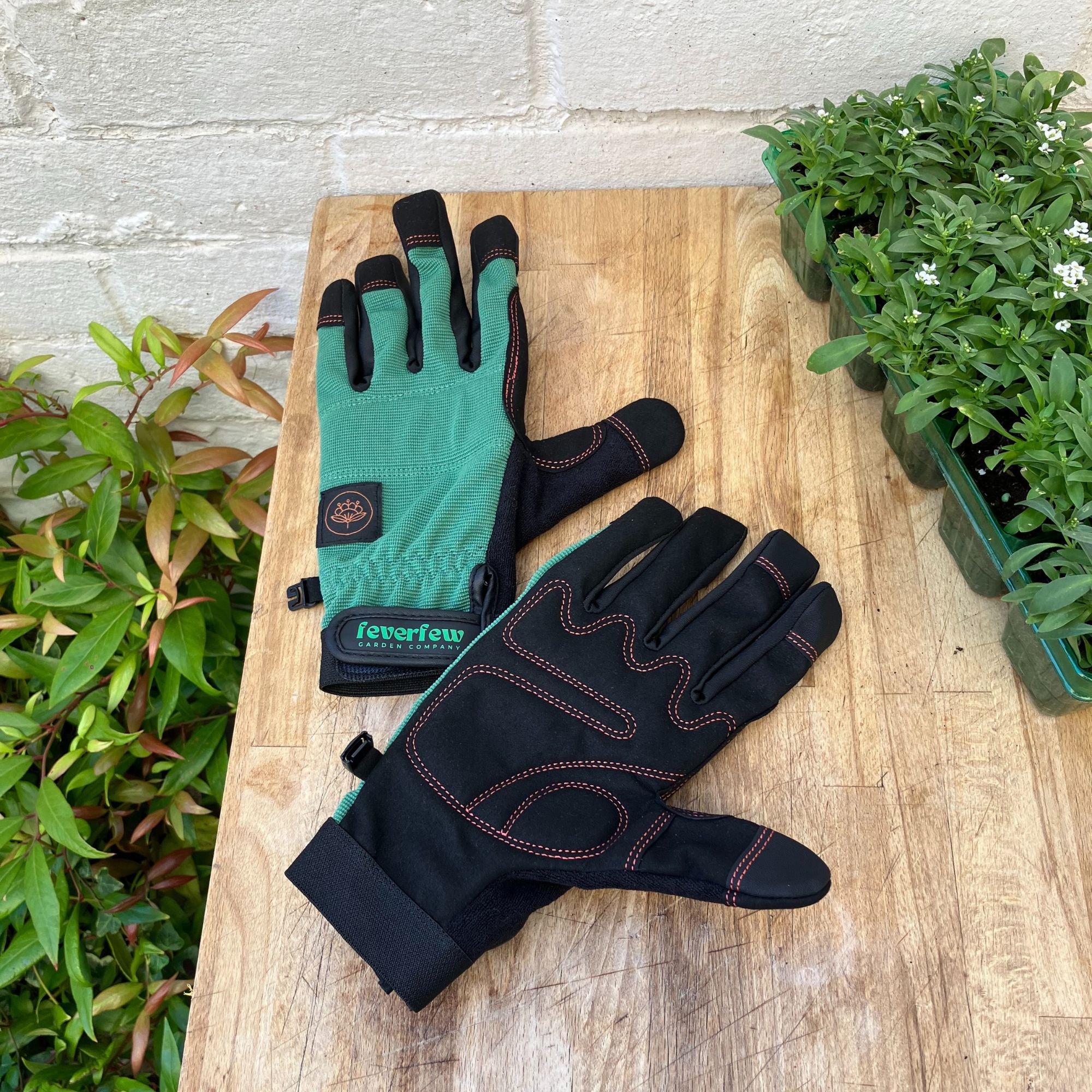 green and black gardening gloves 