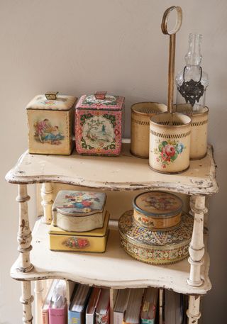 vintage-floral-tins-on-bookshelf-with-vintage-books