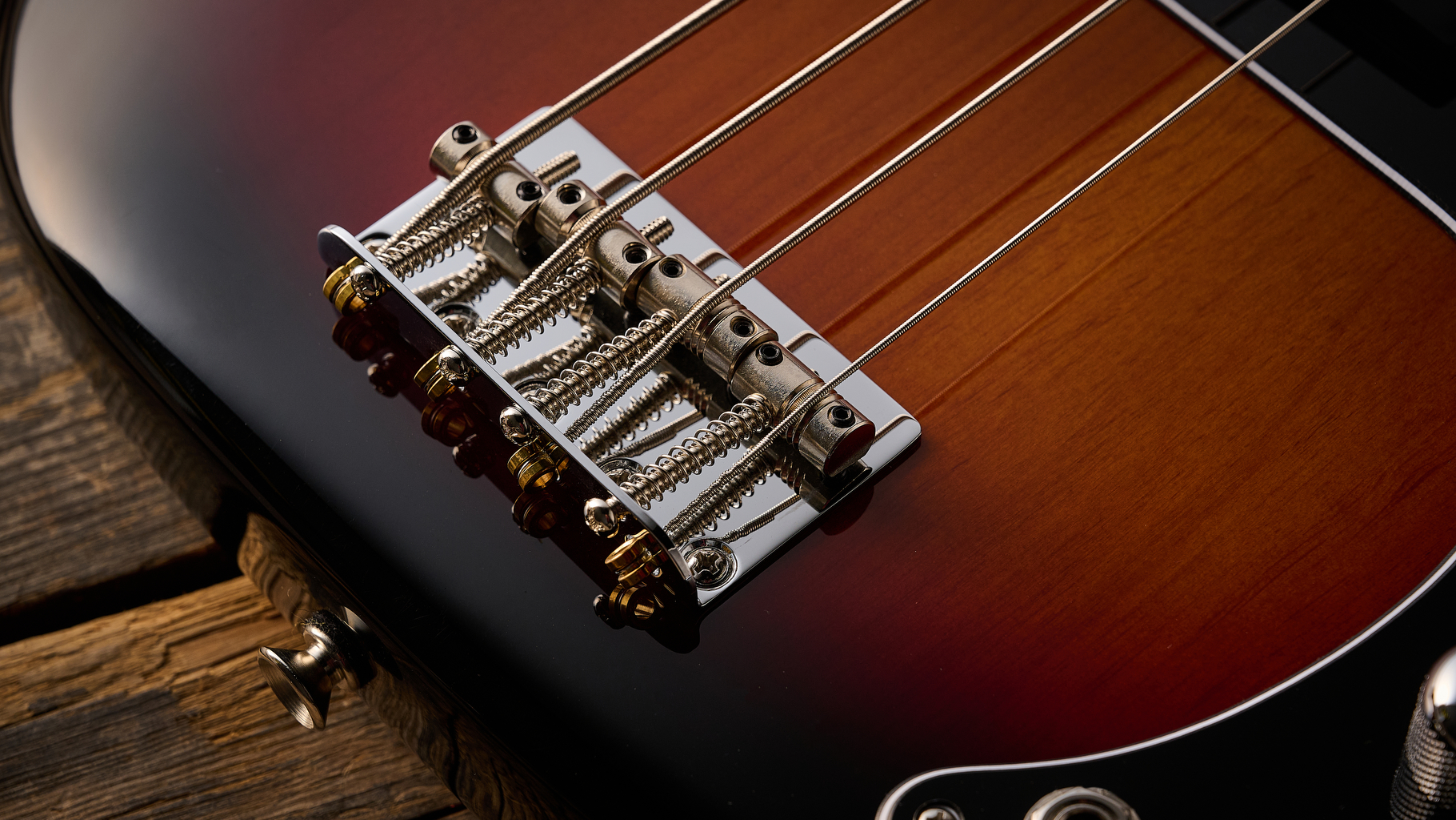 Fender American Professional Classic Precision Bass in 3-Color Sunburst shot on wood floor boards