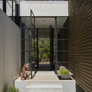 house entrance with black glass door