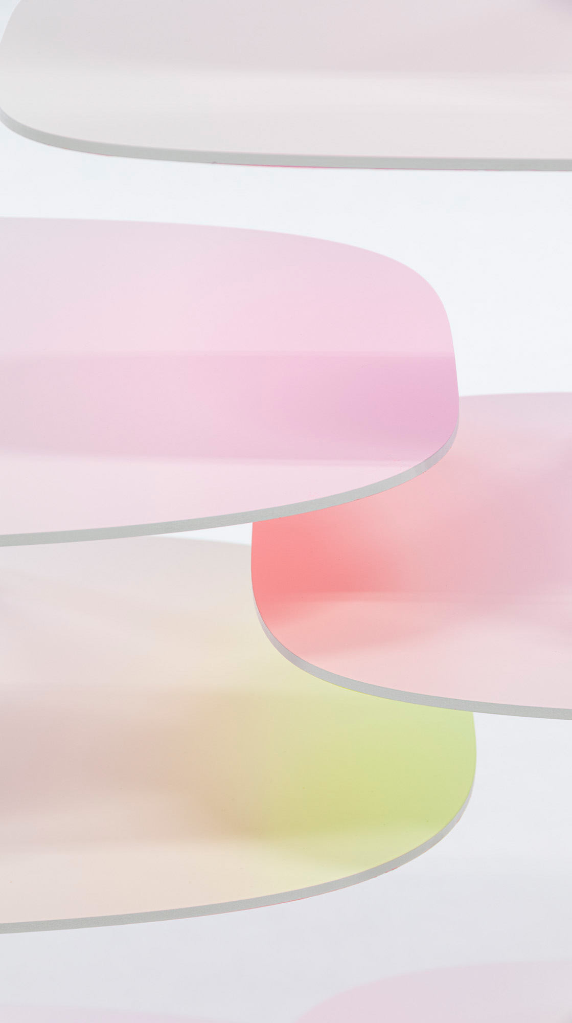 Colourful white shelves with green, pink and yellow shadows by Bijin Davis