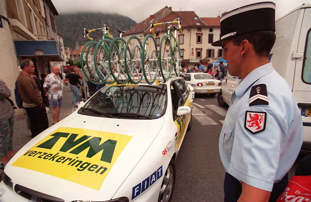 Policemen around the TVM car