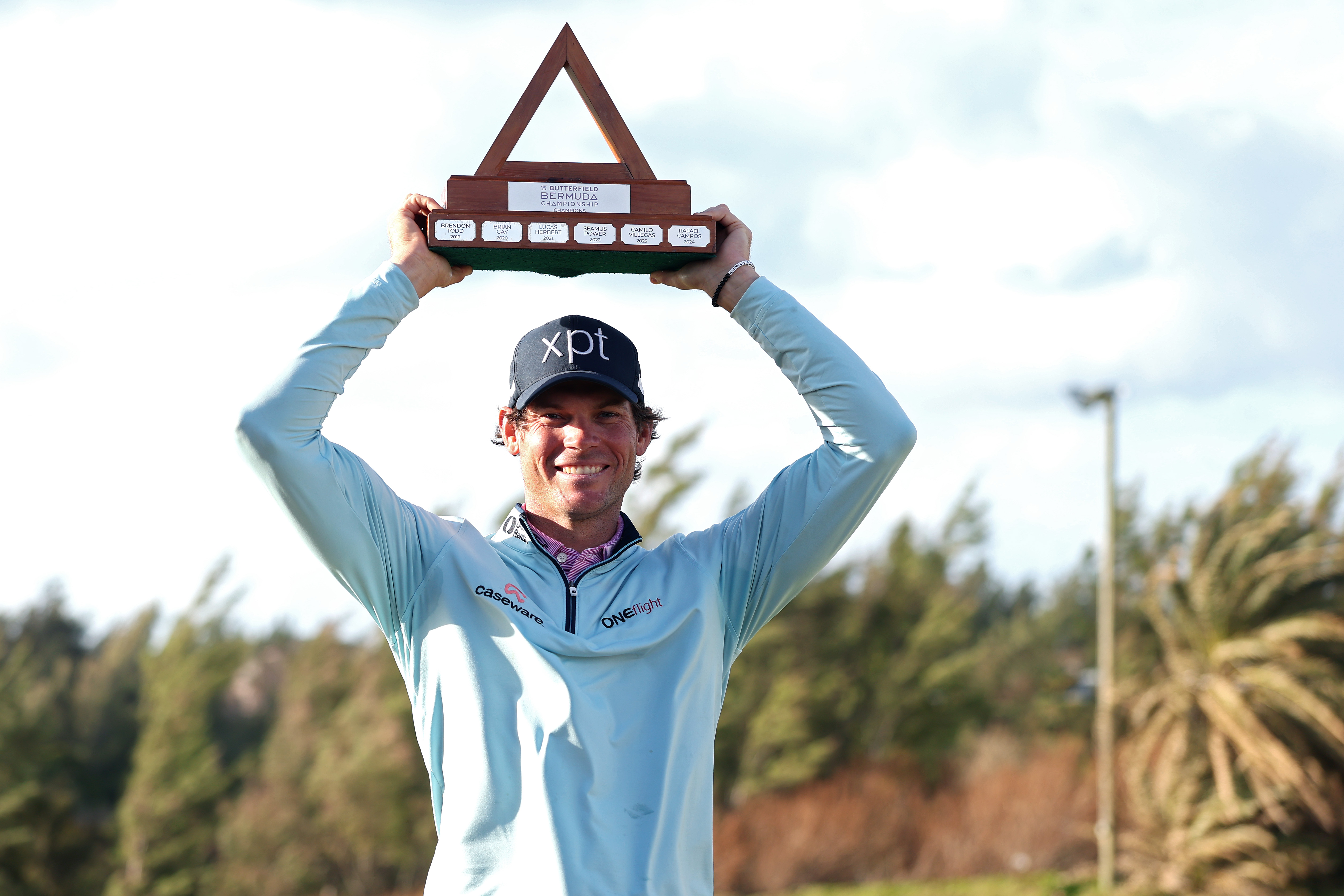 Adam Schenk holds the Butterfield Bermuda Championship trophy