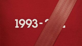 Detail from an ad featuring a year of birth and death with the latter covered by a seatbelt