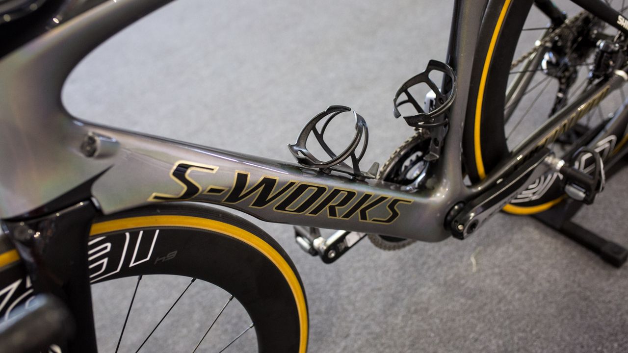 The pearlescent paint and gold lettering represents both the rainbow stripes and gold medal in Doha