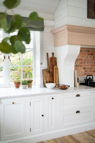 white kitchen with bronze hardware