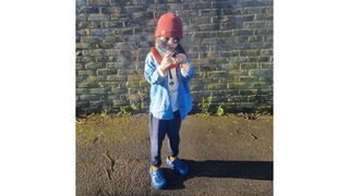 Gentle parenting illustrated by kid standingwith hat on