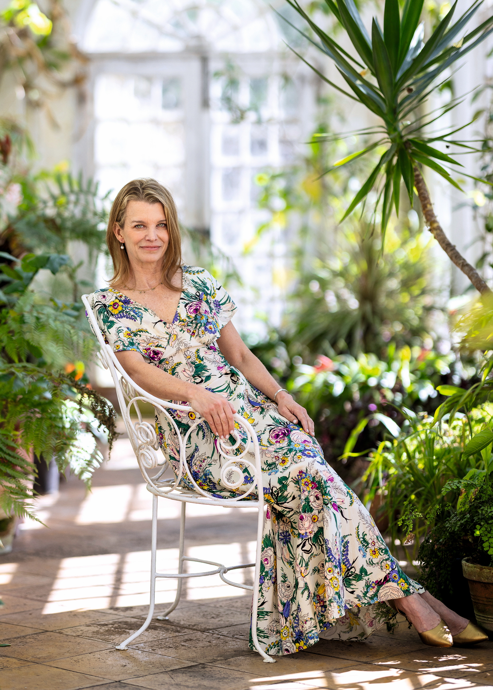 Julia Montagu sitting in a greenhouse