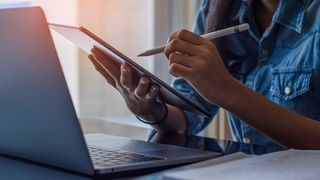 Best note-taking apps for heading back to school, a photo of a woman using a digital tablet