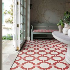 conservatory with red textured floor and potted plants