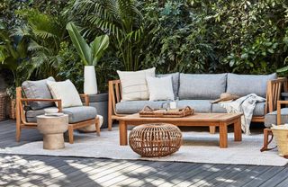 A teak wood outdoor lounge set