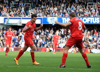 Philippe Coutinho (left) celebrates scoring for Liverpool