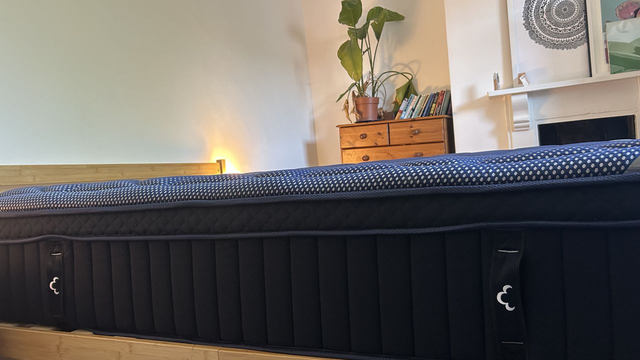 Close detail images of the DreamCloud Luxe Memory Foam mattress, showing design features like the quilted top of the bed and the handles sewn onto the sides