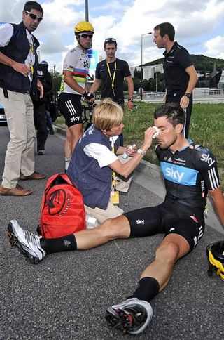 Bernhard Eisel (Sky) is given medical attention following the crash which disrupted the stage 4 finish.