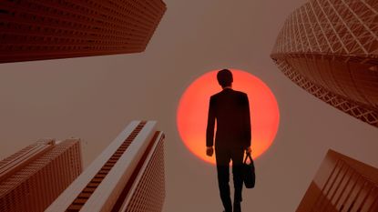 Investor walking into the light surrounded by buildings