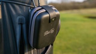 The case of the Blue Tees Series 3 Max Laser Rangefinder on a golf bag