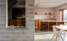 The combination of smooth poured concrete floors, and rough grey brick and blockwork walls, fabricate a tactile, homely feeling in the bottom floor of the Coach House
