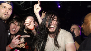 A sweaty Andrew Wk surrounded by fans