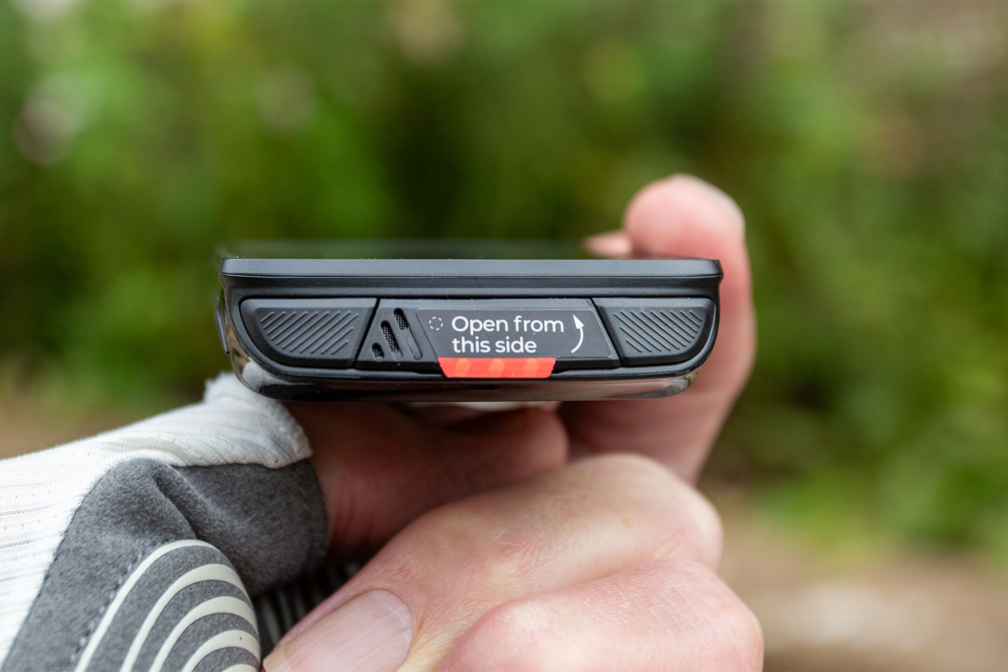 Magene C706 pictured from the rear edge, showing two buttons and charging port cover.
