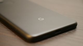 Angled shot of Google logo on the back of Pixel 4a 5G