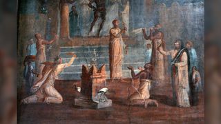 A fresco from Herculaneum shows prayers to Isis in a temple of the cult, while a priest dressed as the Egyptian god Bes performs a ritual dance. What seem to be two ibises — sacred Egyptian birds — can be seen near the foot of a burner in the temple.