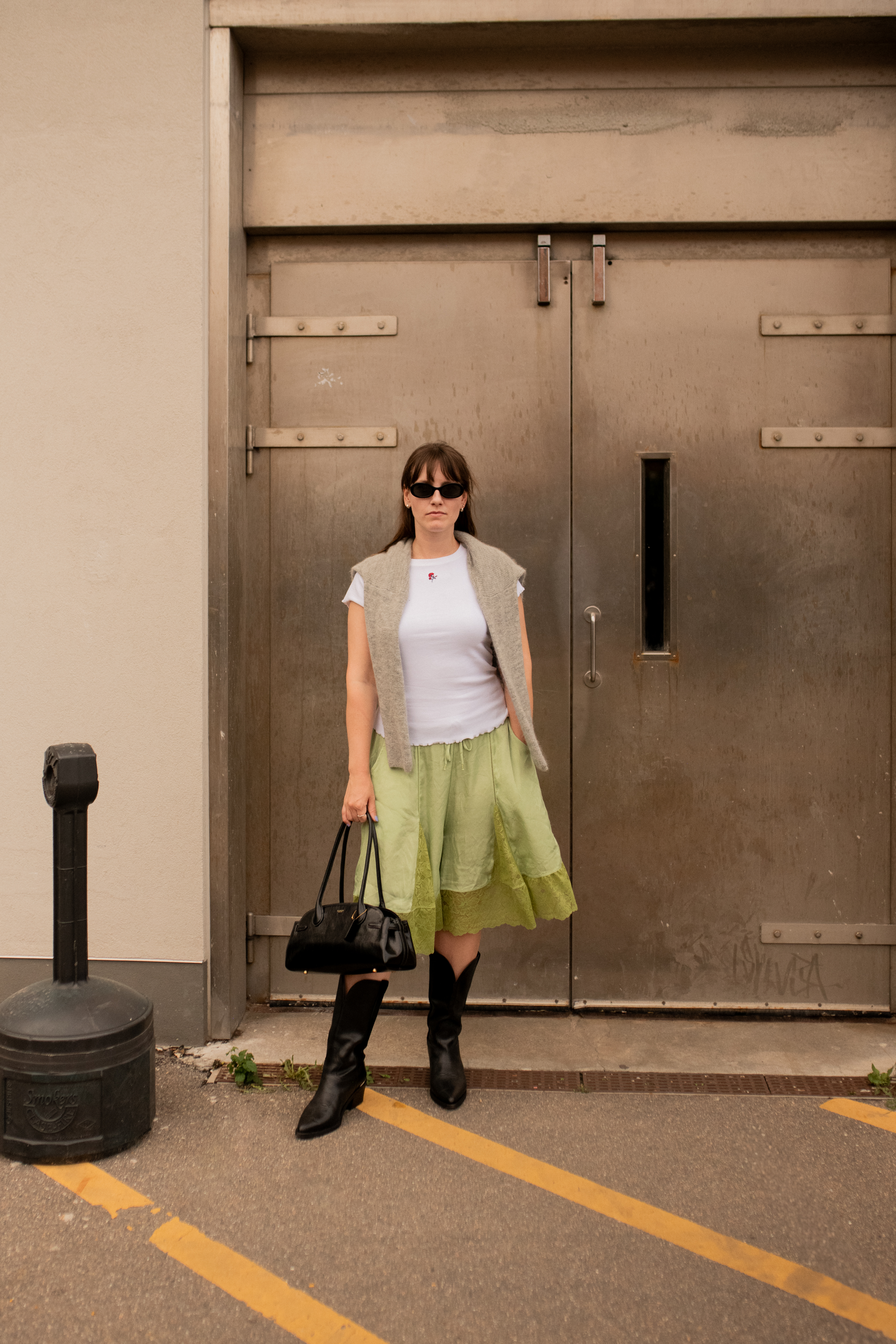 Halie LeSavage wears lace shorts and a t shirt at Copenhagen Fashion Week