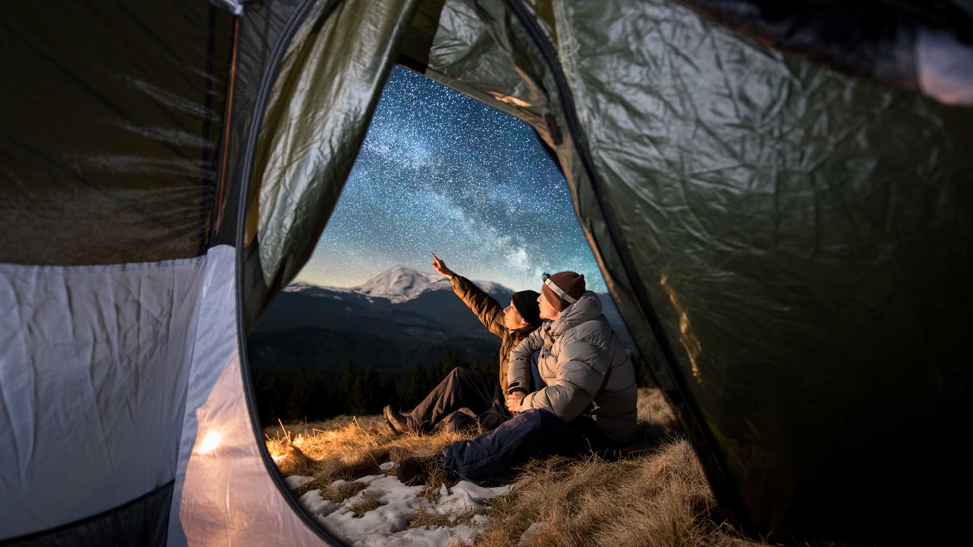 People camp under the night sky