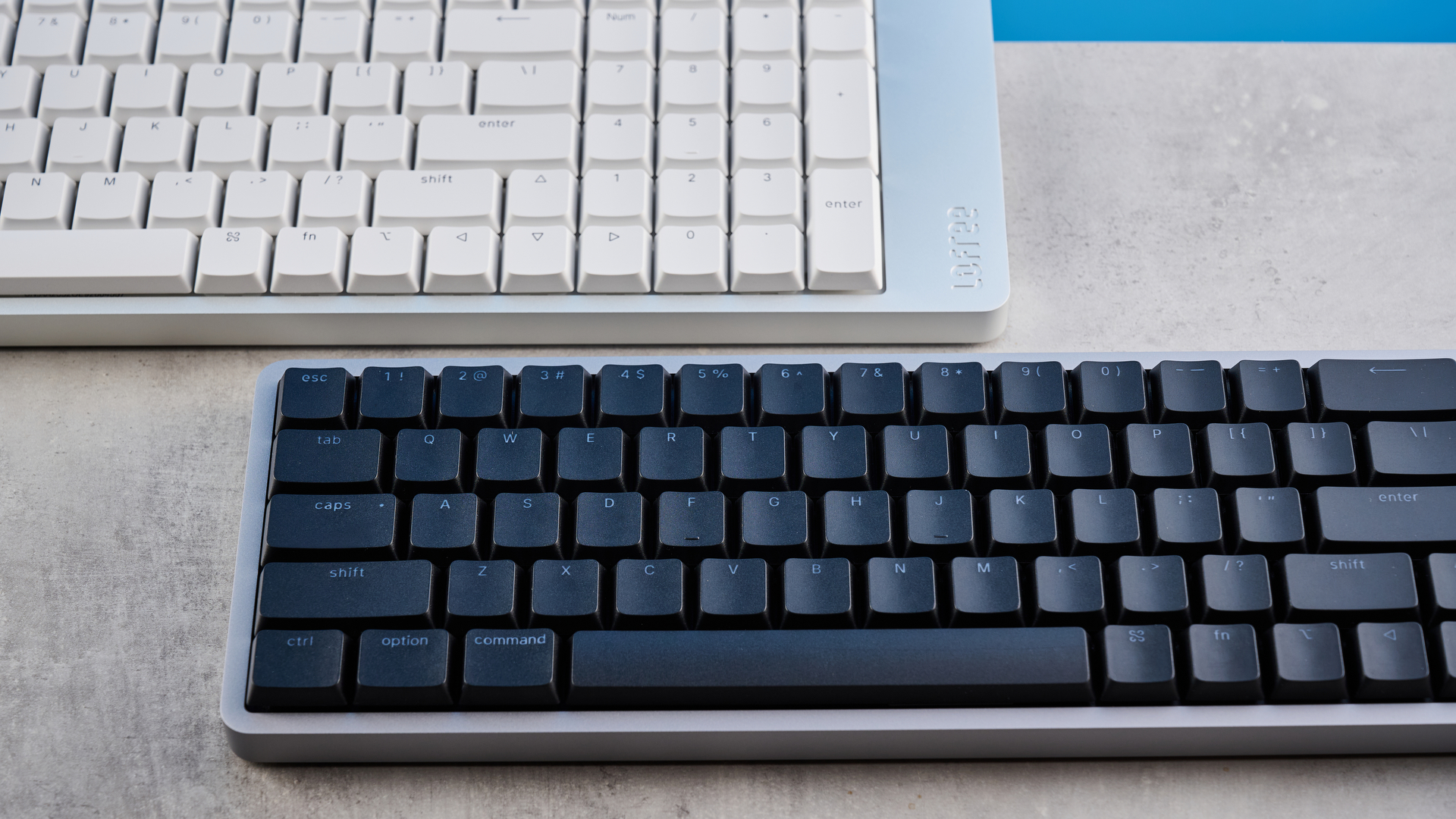 The Lofree Flow 2 on a stone surface with a blue background